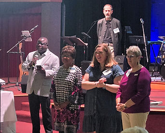 Jessica Scott and the co-lay leaders of the North East District are introduced by District Superintendent, Rev. Dr. Simon Osunlana.