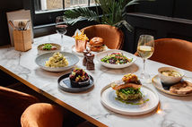 Elegant food and drink spread on white table