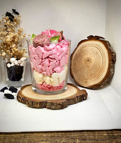 Handcrafted pink and white soy wax candle in a glass jar with rose and strawberry decoration, dessert-style whipped design – MysticGlow handmade candle.
