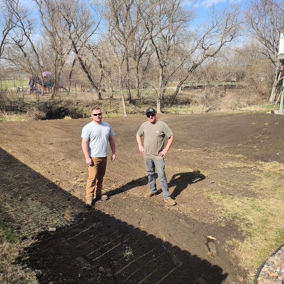 Dave and Ryan standing next to each other at a job site.
