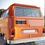 Thumbnail: a black bumper sticker that says "eco>ceo" in white, on the back of an orange van