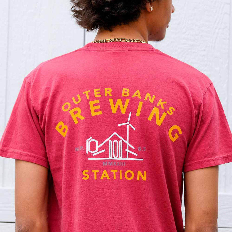 Thumbnail: Person wearing Outer Banks Brewing Station t-shirt with logo; seen from the back