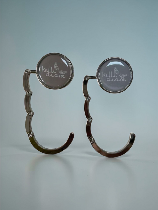 Pair of curved silver earrings with circular studs