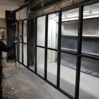 Powder-coated steel partition frame prepared for glass installation