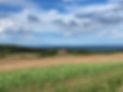 View of the Farm fields woods and sea.