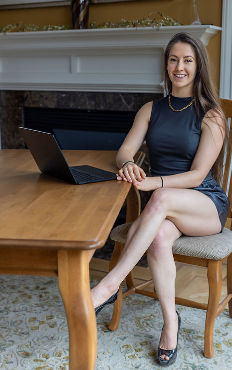 Brianna Meller serving clients at desk