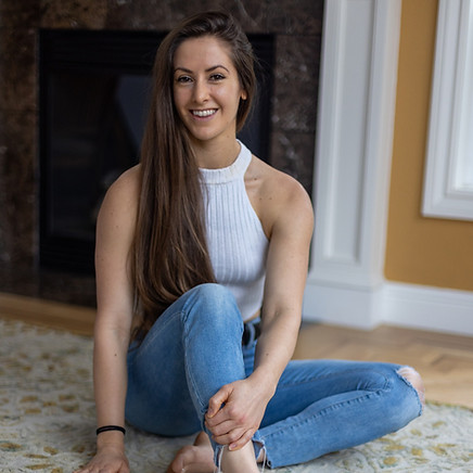 Brianna Meller sitting on floor