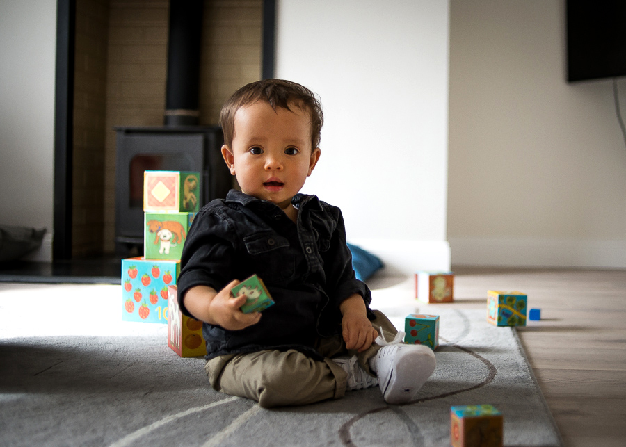 Baby boy playing with blocks - Family session at home in Dublin by Camila Lee