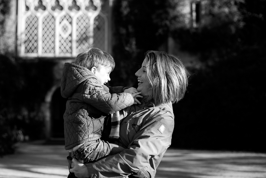 Mother holding her young son, Malahide Castle in the background 