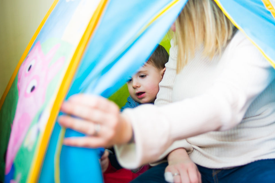 Mum and little boy in tent - Family photography session at home in Dublin by Camila Lee
