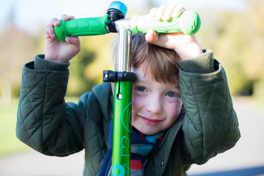 Close up of a boy on a scooter at Malahide Castle, Dublin