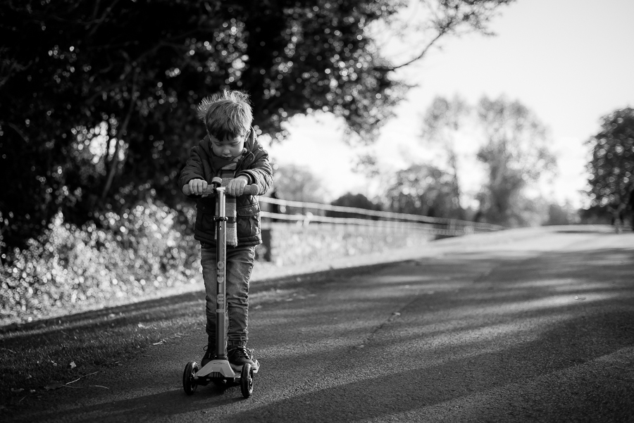 Boy on scooter at Malahide Castle and Gardens in  Dublin