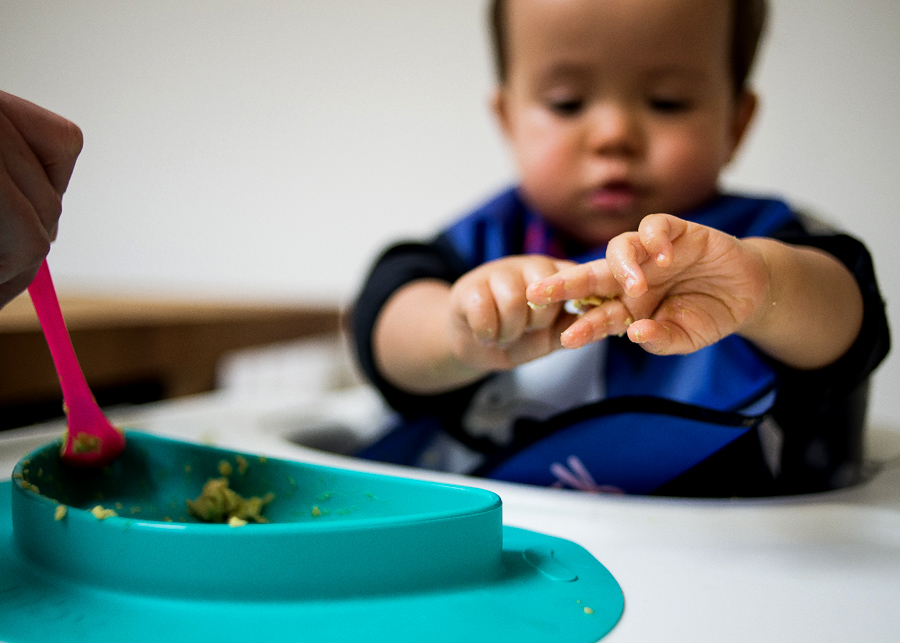 Baby eating with his hands - Family session at home in Dublin