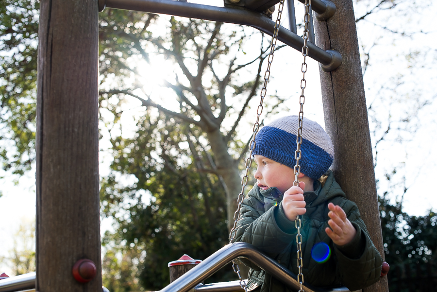 Boy holding a chain at Malahide Castle Playground in Dublin