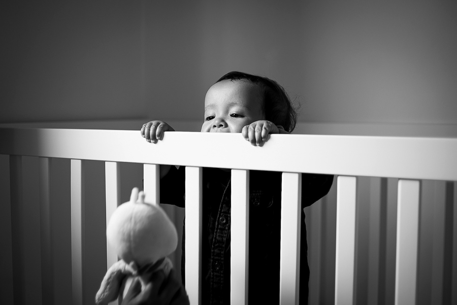 Baby boy in the cot - Family photography session at home in Dublin by Camila Lee