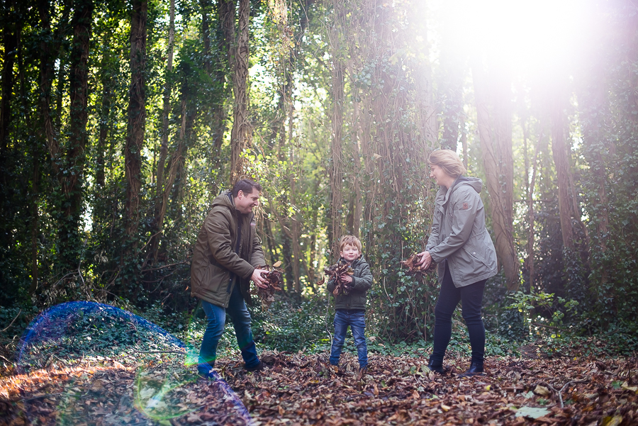 Family playing in the woods at Malahide Castle, Dublin