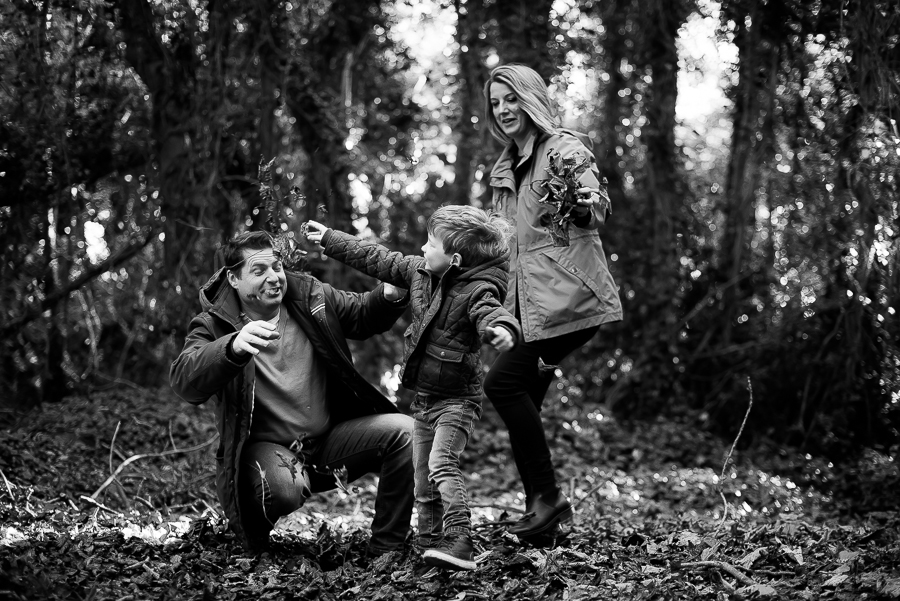 Family playing with leaves outside at Malahide Castle Garden in Dublin