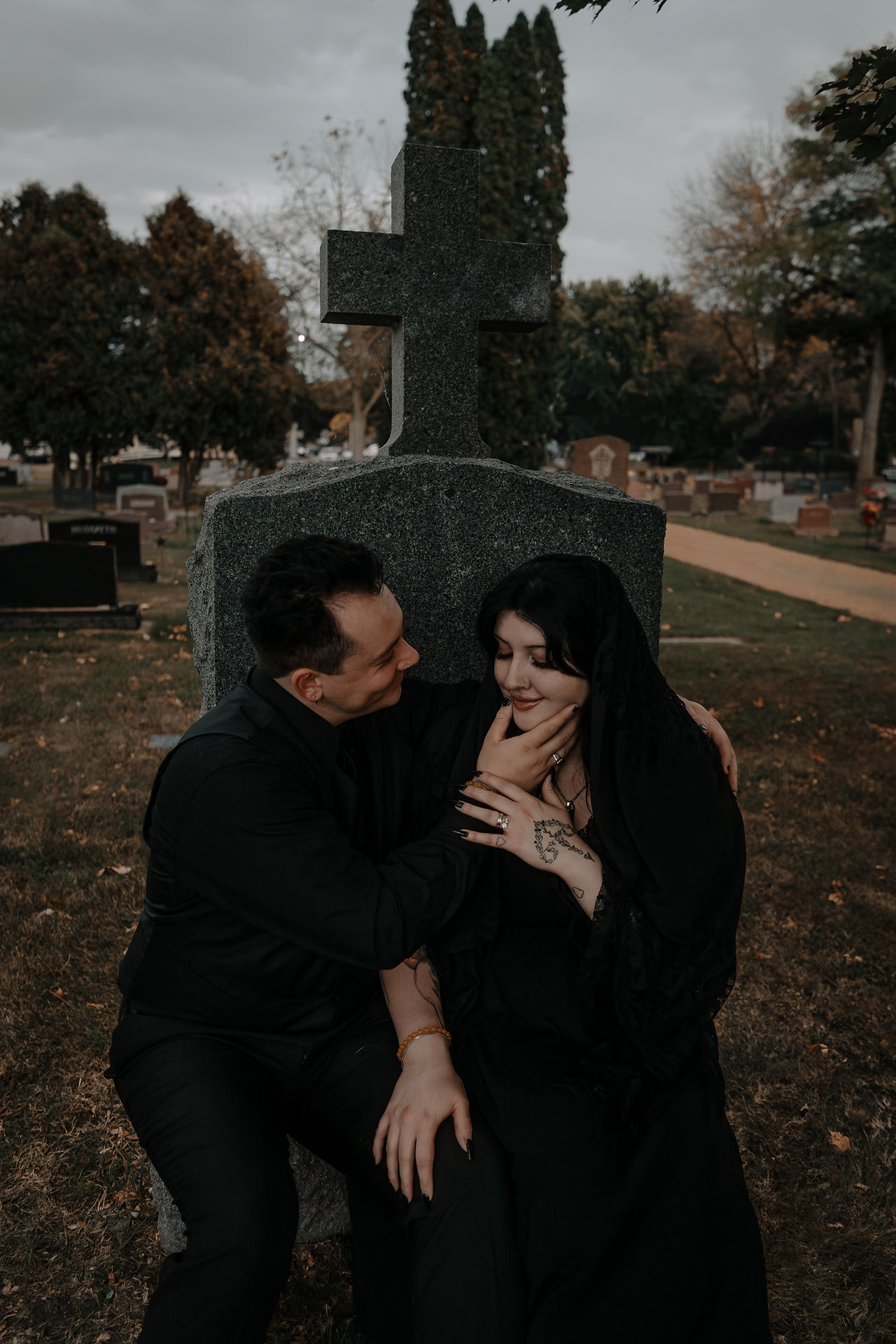 goth couple eloping in graveyard