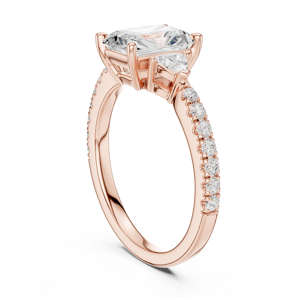Thumbnail: Top-down view of Constance Radiant engagement ring in 14K rose gold showing radiant center, trillion side diamonds, and pavé