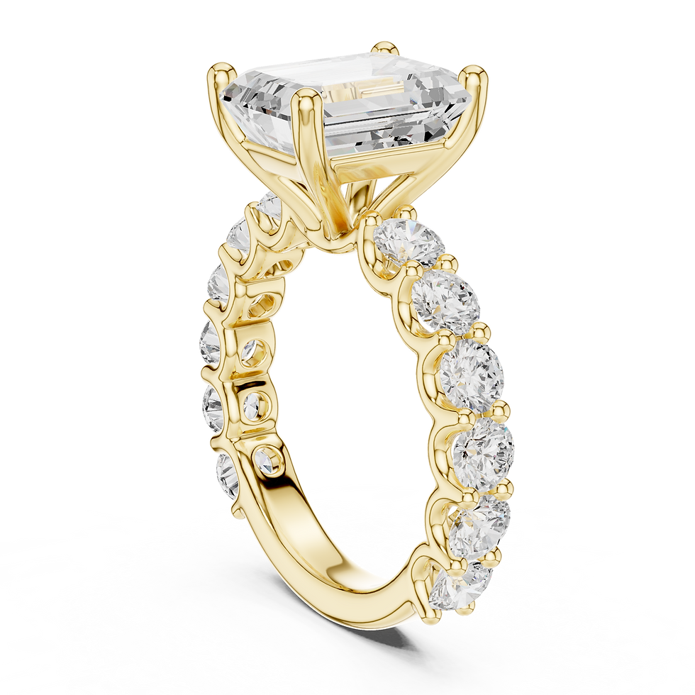 Thumbnail: Three-quarter angle view of Aurelia Emerald engagement ring in yellow gold, highlighting the French pavé shank