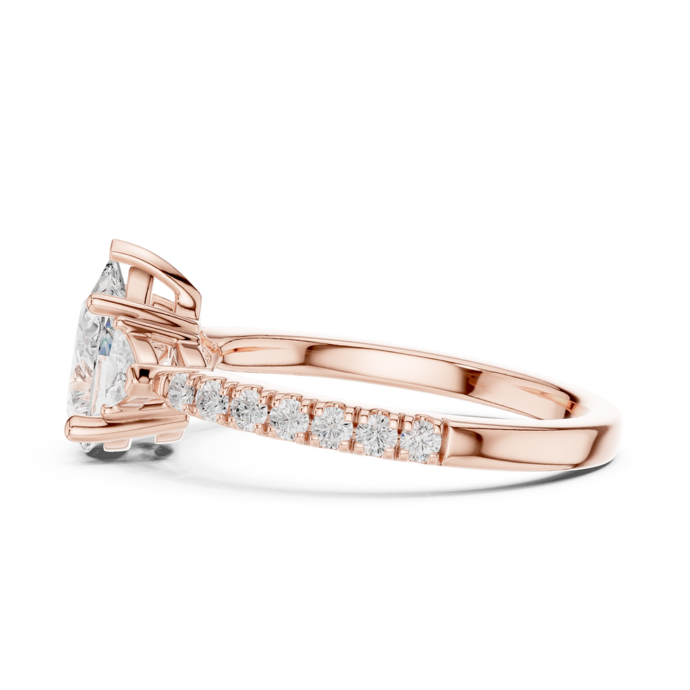 Thumbnail: Side profile of Constance Pear engagement ring in 14K rose gold showing the open basket gallery and pavé band.
