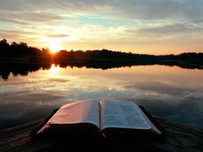 Sacred text open with background scenery
