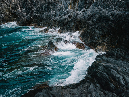 Ocean waves against rocky shoreline