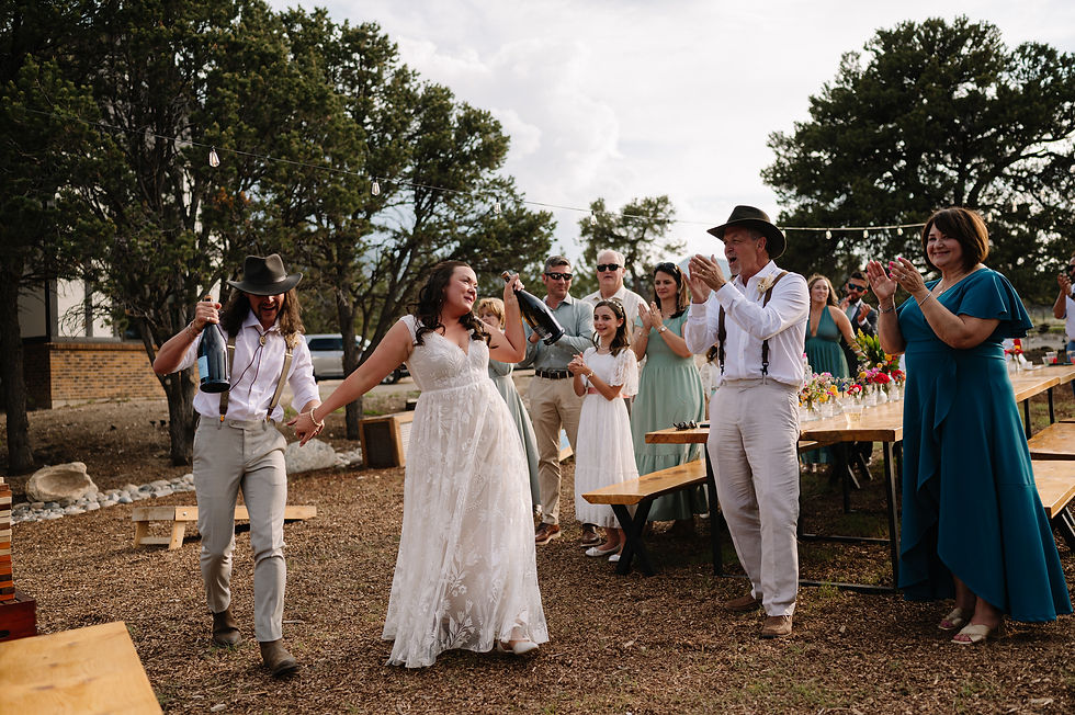 Couple making their reception entrance at Blue Coyote Ranch wedding venue