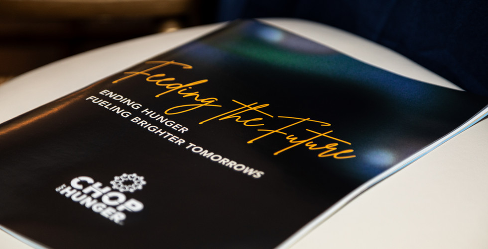 Program cover featuring "Feeding the Future" and the CHOP Out Hunger logo