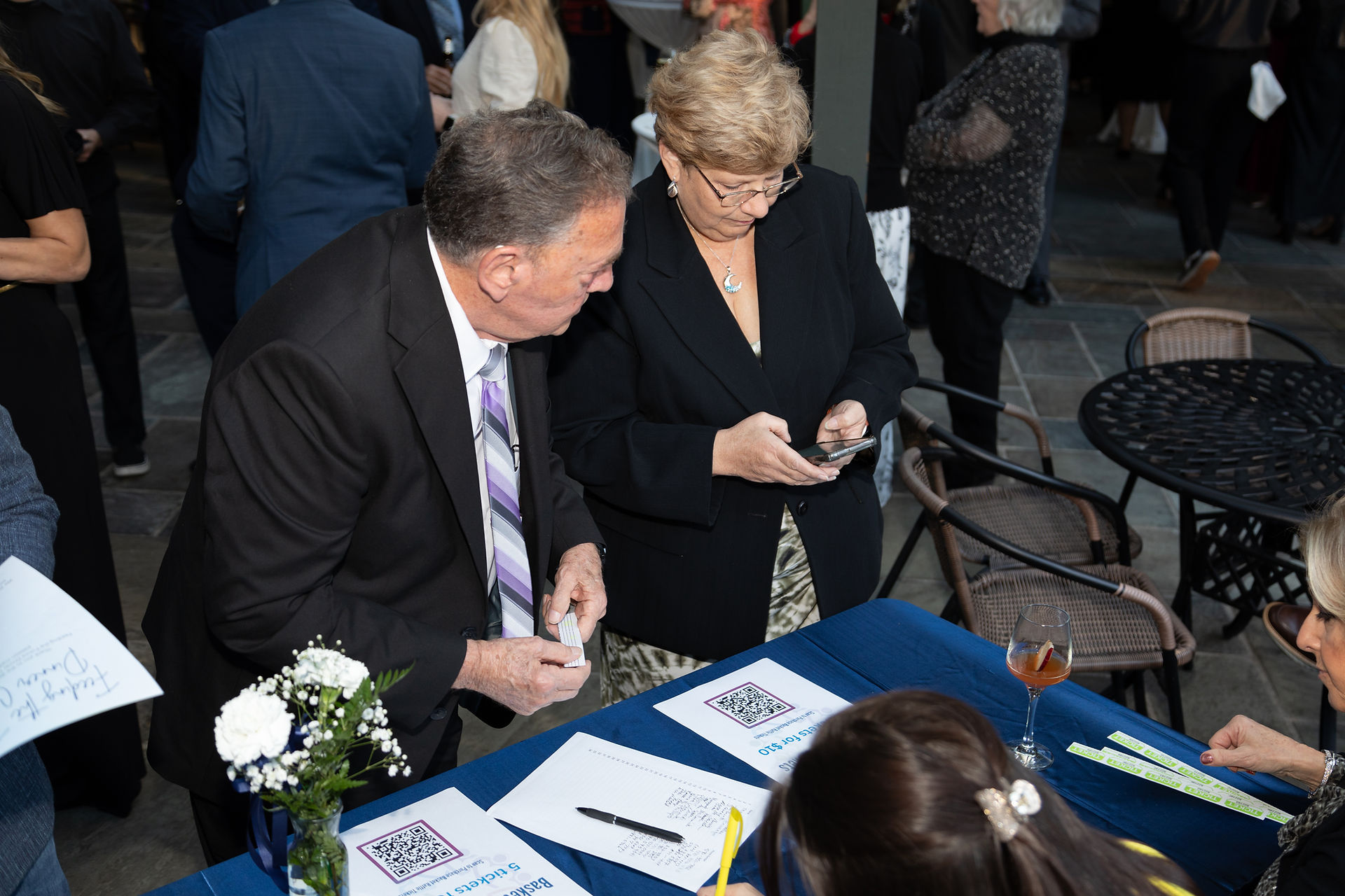 Guests smiling at Feeding the Future fundraiser for CHOP Out Hunger