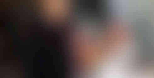 Guests smiling at Feeding the Future fundraiser for CHOP Out Hunger