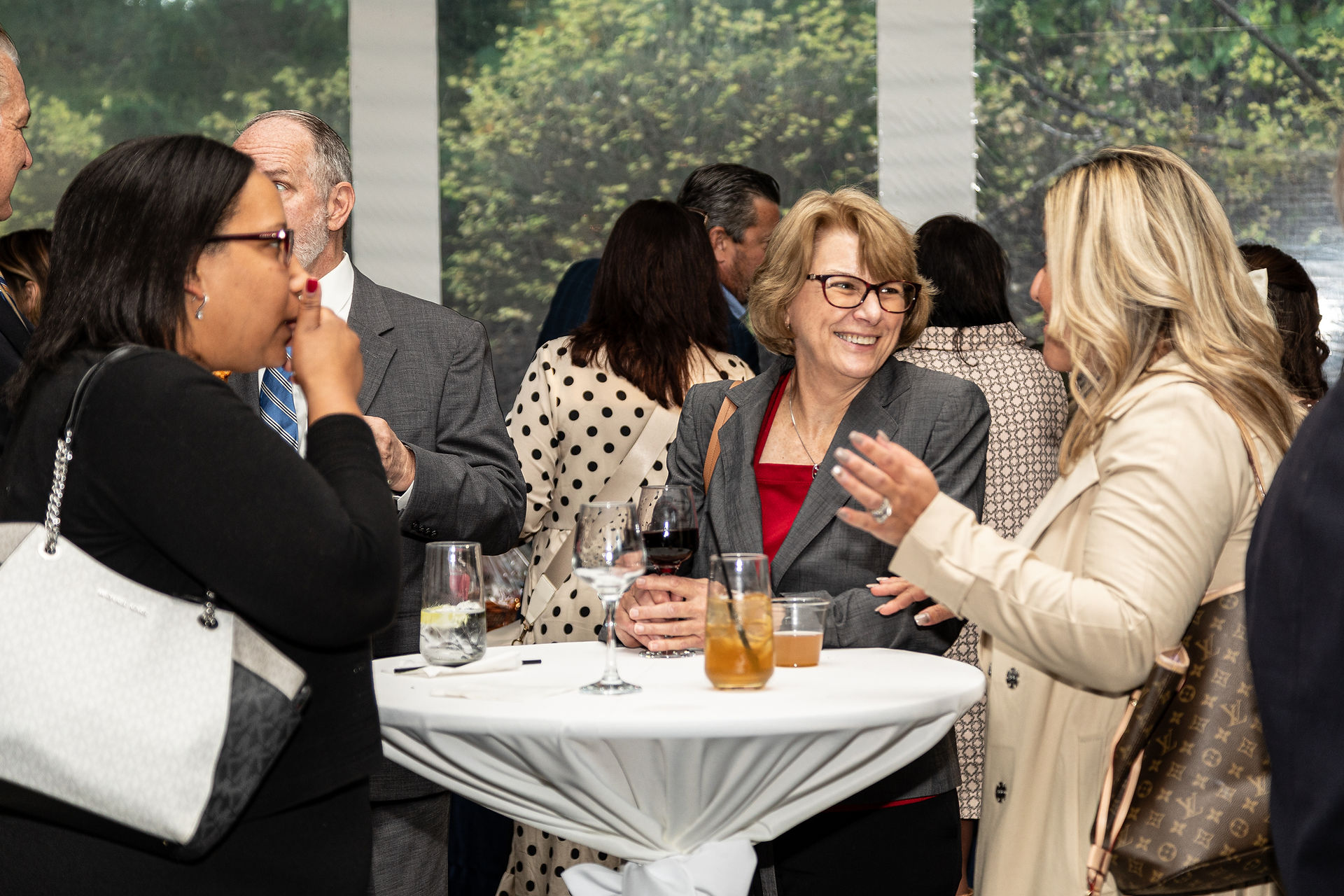 Guests smiling at Feeding the Future fundraiser for CHOP Out Hunger