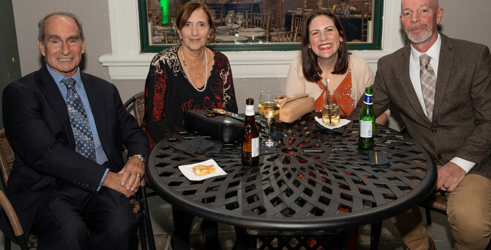 Guests smiling at Feeding the Future fundraiser for CHOP Out Hunger