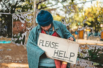 beggars-stand-on-the-street-with-homeless-messages-R88HH6H_edited.jpg