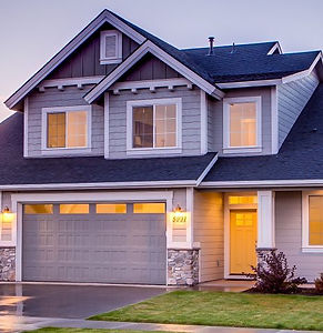 Modern home exterior showing subtle tint of Solar Gard Ceramic CX window film on windows