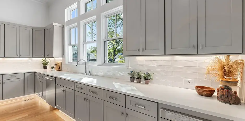 Gray shaker kitchen cabinetry with stone countertops and under-cabinet LED lighting for a Nashville, TN kitchen project.