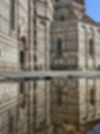 Reflection of the Duomo in a rain puddle in Florence