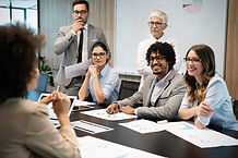 Group of business people working together, brainstorming in office.jpg