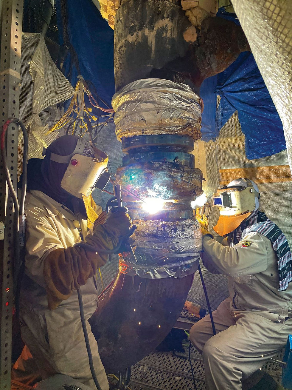 Welder working on high energy piping