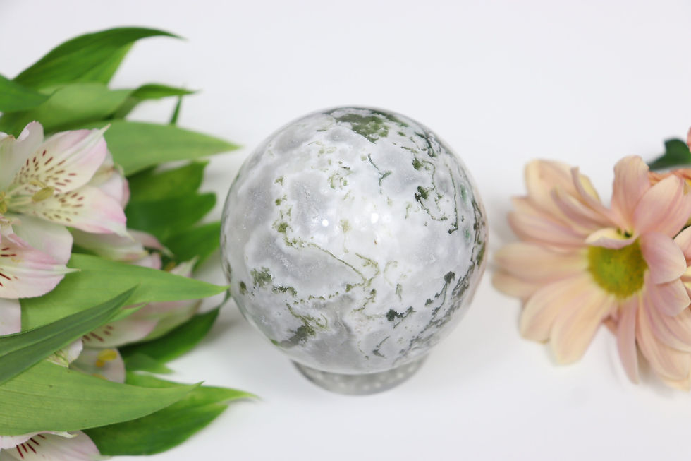 Thumbnail: A beautiful mostly white moss agate sphere with streaks of green throughout for an earthy vibe