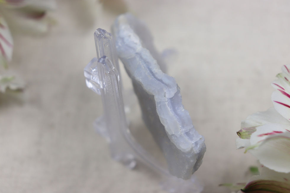 Thumbnail: A small piece of raw blue lace agate on a cream background