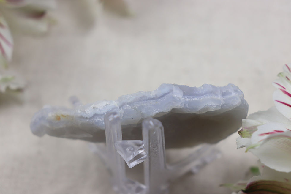 Thumbnail: A small piece of raw blue lace agate on a cream background