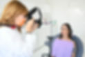 Dentist photographing patient's smile, Yiannikos Dentistry