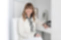 Smiling woman in white blouse, Yiannikos Dentistry