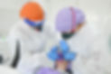Dental professionals performing procedure