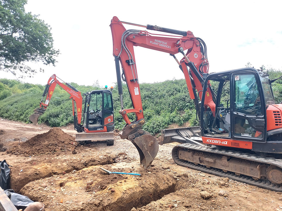 excavator trenching on construction site