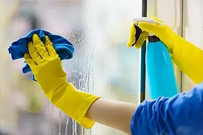 closeup-of-someone-cleaning-their-inside-window-with-a-microfibre-cloth.webp