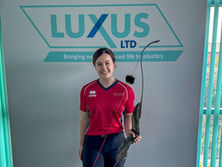 Natalie Stones, Team GB archer, in her archery attire at Luxus Ltd, her employer and sponsor.
