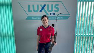 Natalie Stones, Team GB archer, in her archery attire at Luxus Ltd, her employer and sponsor.