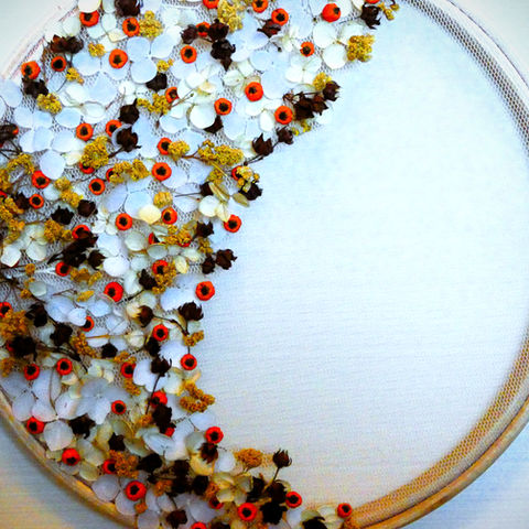 Autumnal dried flowers and berries in a circular hoop